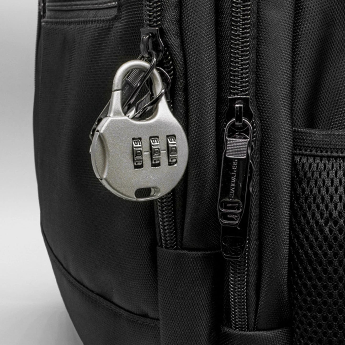 Luggage lock with a 3-digit combination.